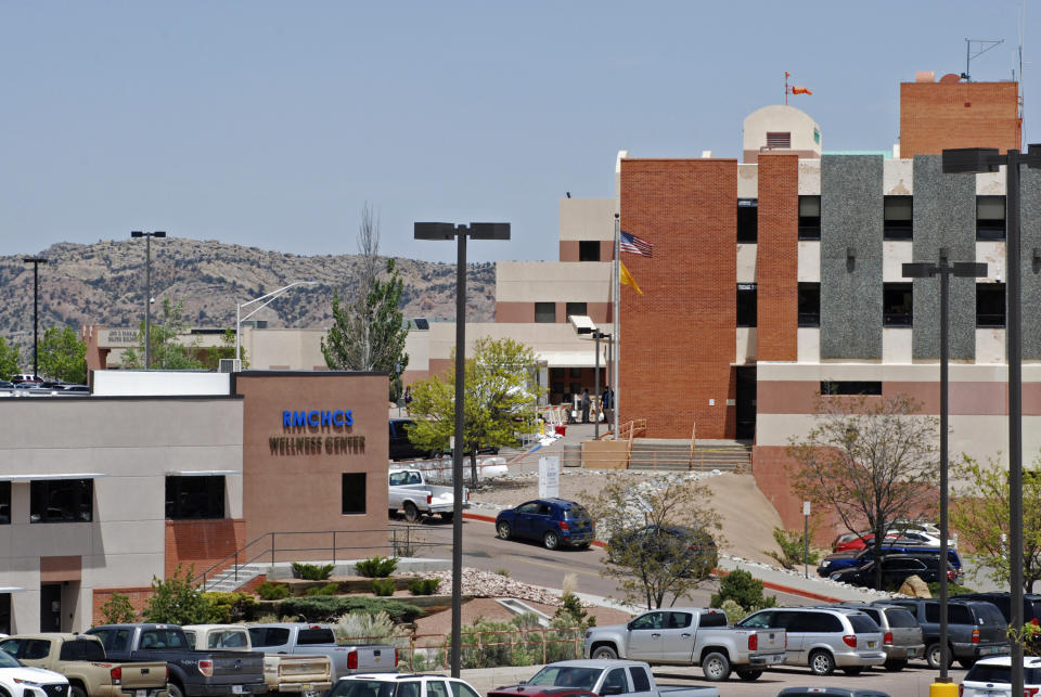 This May 8, 2020, photo shows Rehoboth McKinley Christian Hospital in Gallup, N.M. Of about 500 medical and support staff, at least 32 hospital workers have become infected, and doctors and nurses say that they all live with the fear of spreading the virus to their colleagues and relatives. (AP Photo/Morgan Lee)