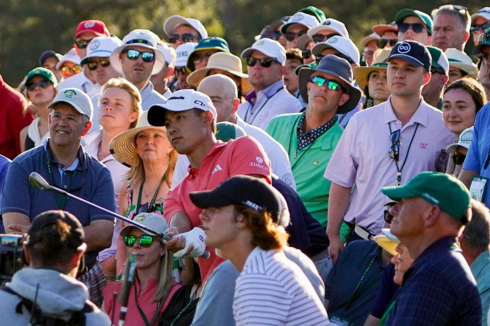 Collin Morikawa chips from the side of the 18th green of the Augusta National Golf Club during the third round of the Masters Tournament on April 13.