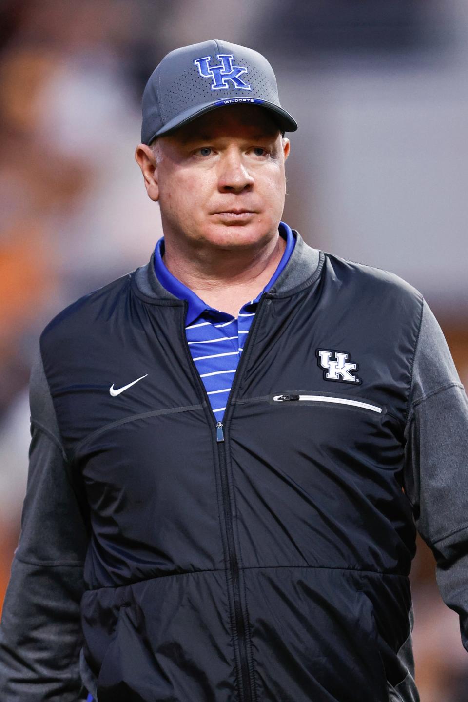 Kentucky head coach Mark Stoops watches as his team warms up before an NCAA college football game against Tennessee, Saturday, Oct. 29, 2022, in Knoxville, Tenn. (AP Photo/Wade Payne)
