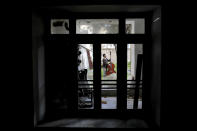 Musician Arif Mirbaghi plays double bass at the yard of his house during mandatory self-isolation due to the coronavirus outbreak in Tehran, Iran on April 5, 2020. With performance halls closed and many people staying in their homes, Iranian musicians now find performance spaces where they can. (AP Photo/Ebrahim Noroozi)