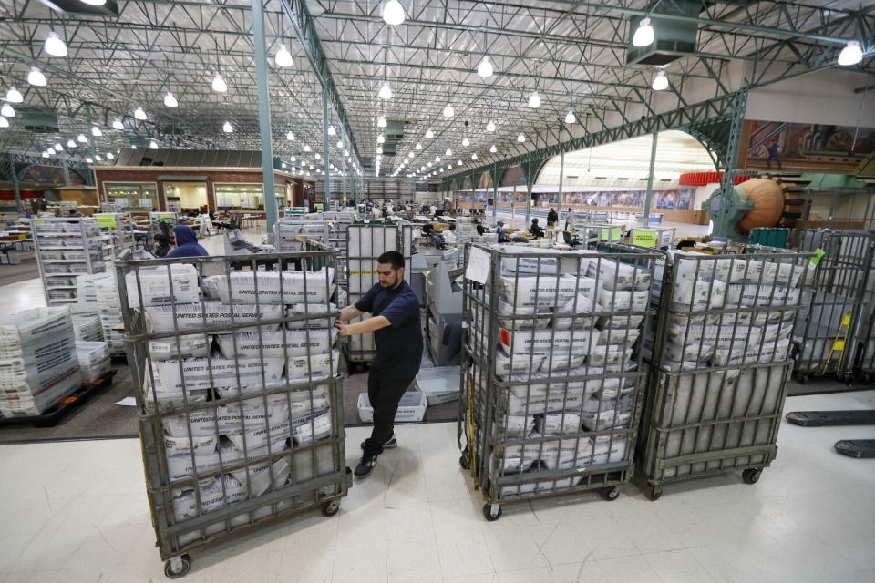 Ballots are received, sorted and verified at the L.A. County ballot processing facility.