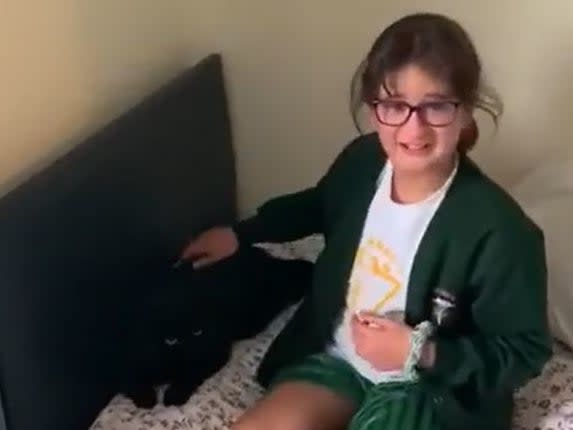 Screen grab from footage issued by Cats Protection of 10-year-old Katya Harmon, from Woking, being reunited with her cat Timmy after he had been missing for nine months (PA)
