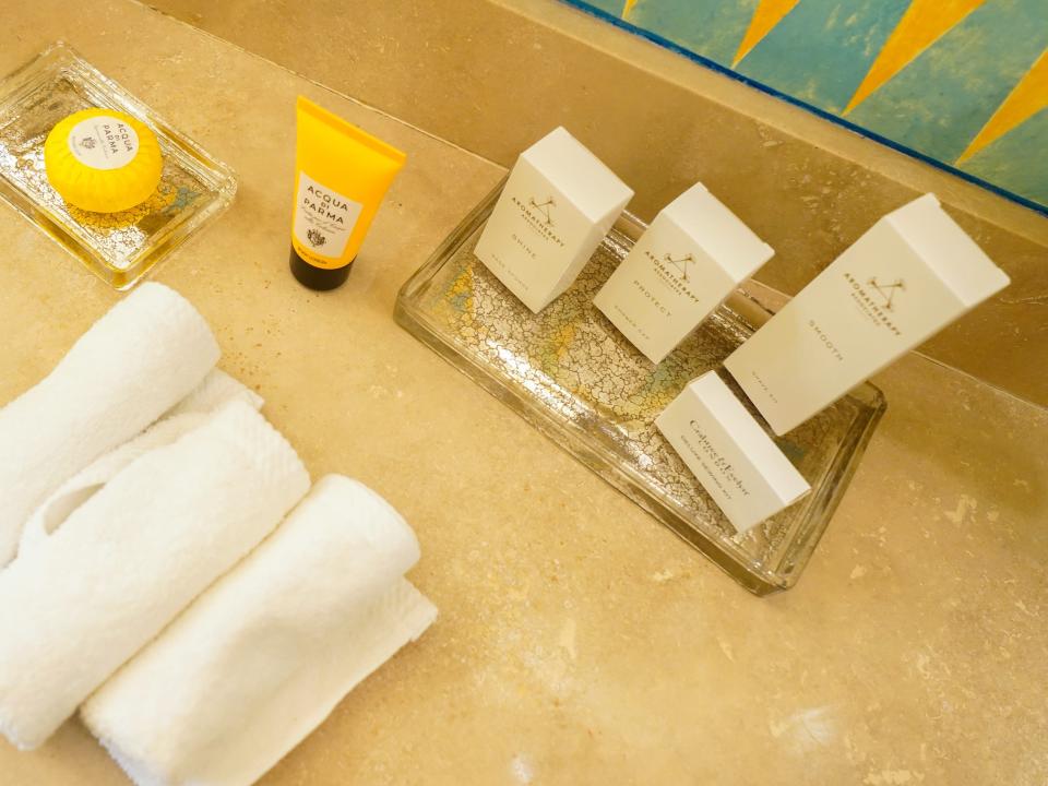 A close up of toiletries in the bathroom of the Aurora Suite in the former Versace Mansion