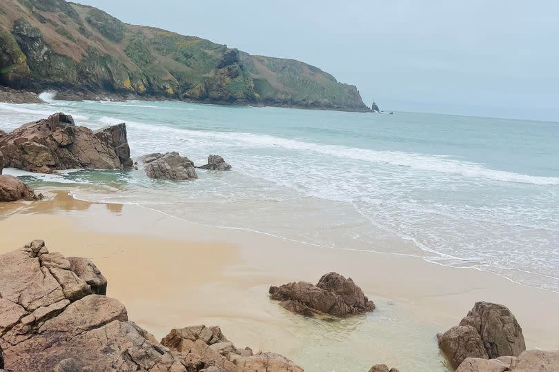 The stunning Plemont Bay in Jersey with a freshwater waterfall, hidden caves and rock pools to explore. -Credit:BirminghamLive