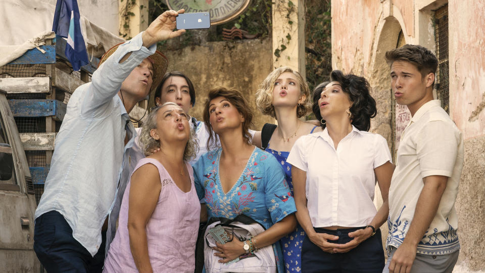 This image released by Focus Features shows, from left, John Corbett, Maria Vacratsis, Melina Kotselou, Nia Vardalos, Elena Kampouris, Andrea Martin and Elias Kacavas in a scene from "My Big Fat Greek Wedding 3." (Yannis Drakoulidis/Focus Features via AP)