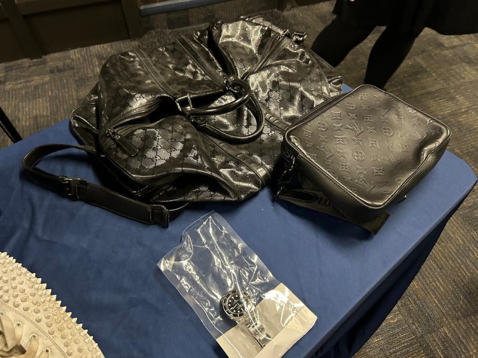 Louis Vuitton bags and a Rolex watch were among items seized by Winnipeg police.