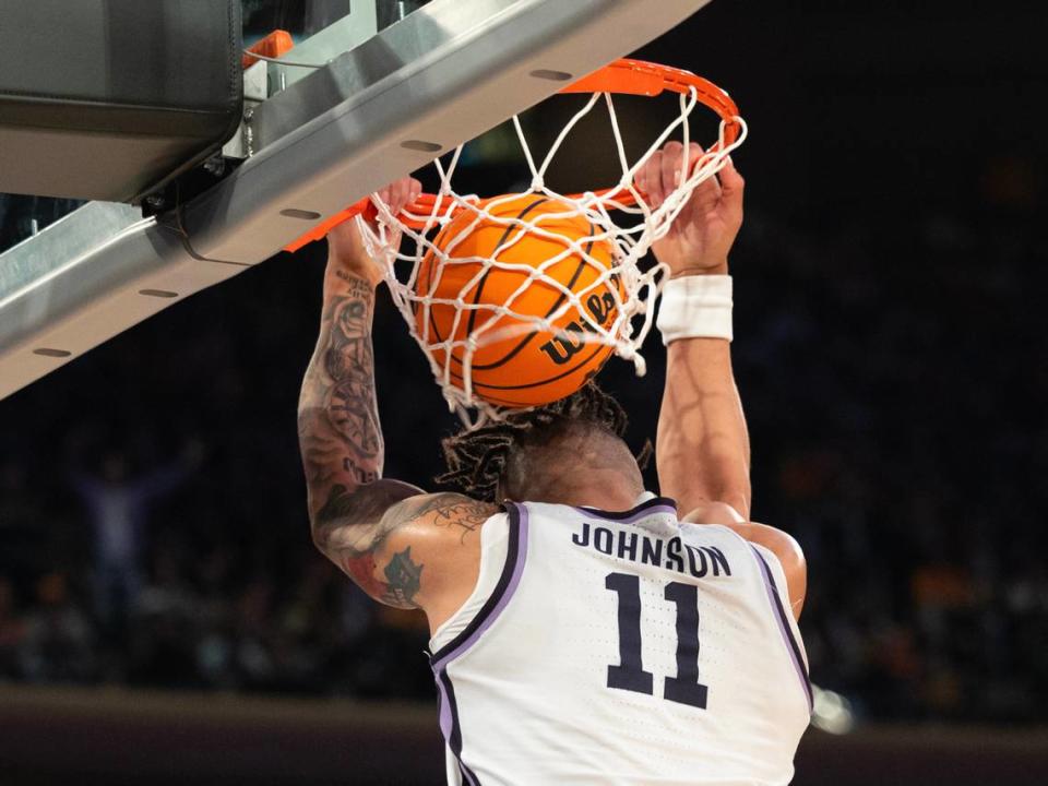 Kansas State’s Keyontae Johnson makes a reverse dunk off a lob pass from teammate Markquis Nowell during overtime of their east region semifinal game against Michigan State at Madison Square Garden on Thursday night.