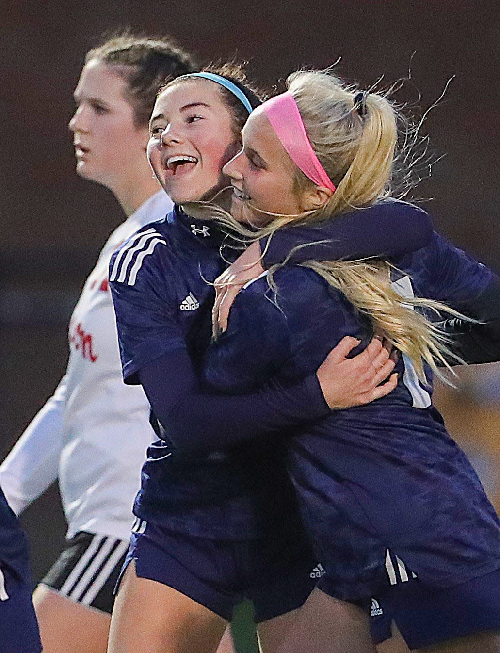 Twinsburg's Rein Cummings, left, celebrates a first half goal with teammate Emma Trudell, her second, against Chardon in a Division I sectional tournament game on Thursday, Oct. 20, 2022 in Twinsburg.