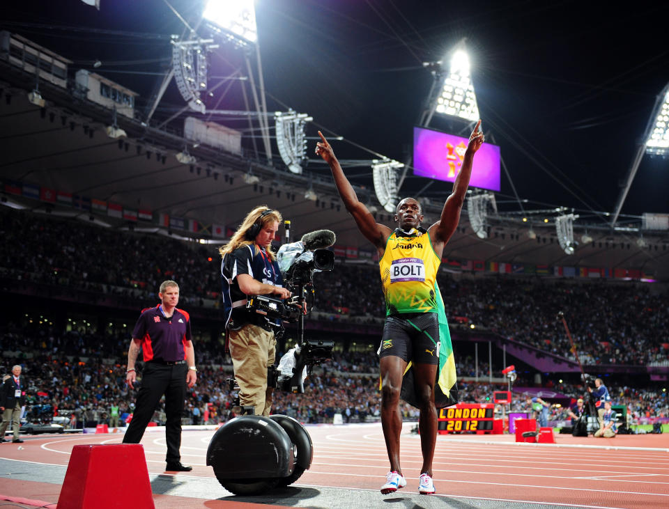 Usain Bolt of Jamaica celebrates winning gold in the Men?s 100m Final on Day 9 of the London 2012 Olympic Games at the Olympic Stadium on August 5, 2012 in London, England. (Photo by Stu Forster/Getty Images)