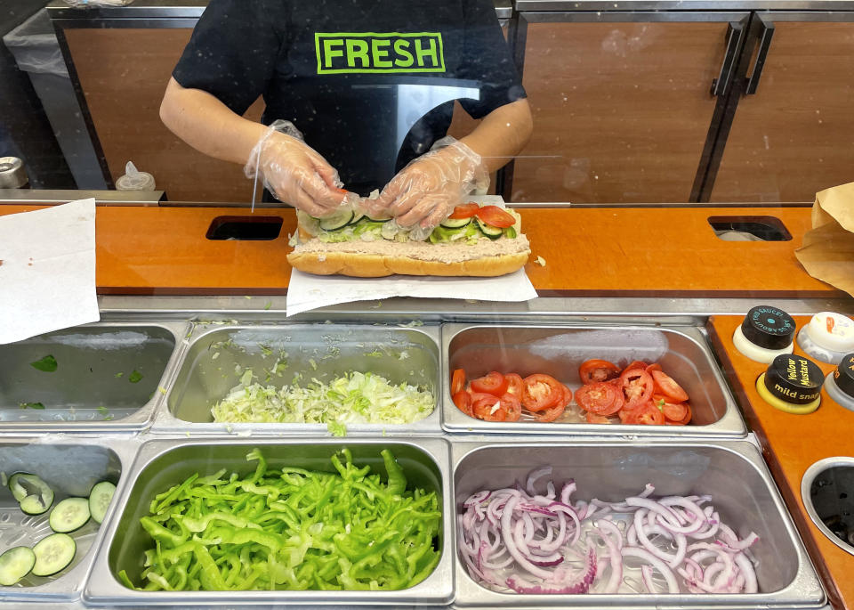 SAN ANSELMO, CALIFORNIA - JUNE 22: A worker at a Subway sandwich shop makes a tuna sandwich on June 22, 2021 in San Anselmo, California. A recent lab analysis of tuna used in Subway sandwiches commissioned by the New York Times did not reveal any tuna DNA in samples taken from Subway tuna sandwiches. The lab was unable to pinpoint a species in the tuna samples from three Los Angeles area Subway sandwich shops. (Photo by Justin Sullivan/Getty Images)