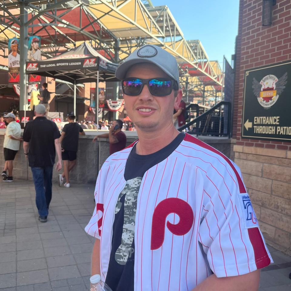Rob Cras, a lifelong Phillies fan, stands outside Chase Field on Oct. 19, 2023, before Game 3 against the Arizona Diamondbacks.