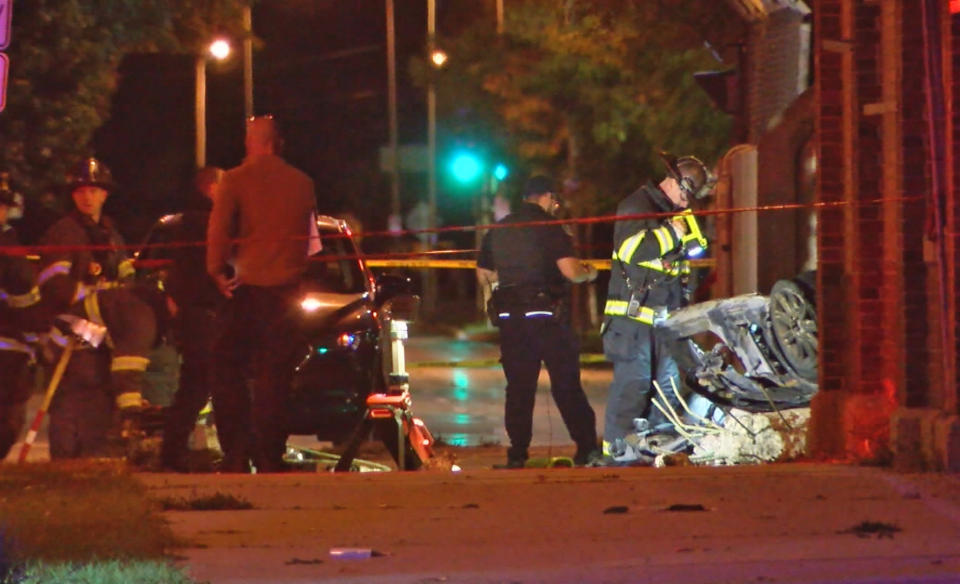 Milwaukee police officers and firefighters responded to the scene after a car involved in a police pursuit fell 35 feet off a bridge and caught fire. (WTMJ)