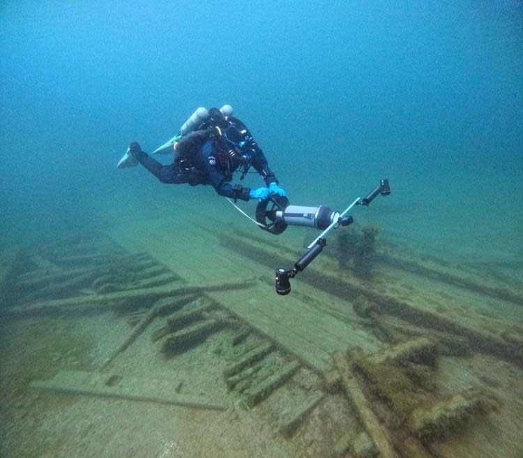  A diver from the Wisconsin Historical Society collects photos for a 3D photogrammetry model of the Muir. / Credit: Tamara Thomsen, Wisconsin Historical Society