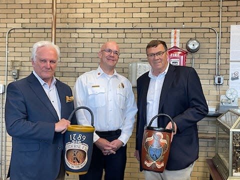 The Federal Fire Society and the Mechanic Fire Society, both of Portsmouth, commissioned special traditional leather fire buckets for the Portsmouth Fire Department and presented them to Fire Chief William McQuillen in a ceremony on May 5.