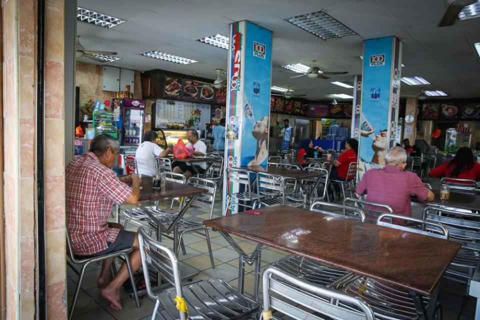 Patrons are pictured at an restaurant in Subang Jaya as the movement control order kicks in on March 18, 2020. — Picture by Yusof Mat Isa