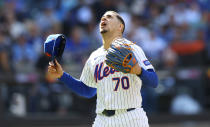 New York Mets starting pitcher Jose Butto reacts on his way to the dugout during the sixth inning of a baseball game against the Kansas City Royals, Sunday, April 14, 2024, in New York. (AP Photo/Noah K. Murray)
