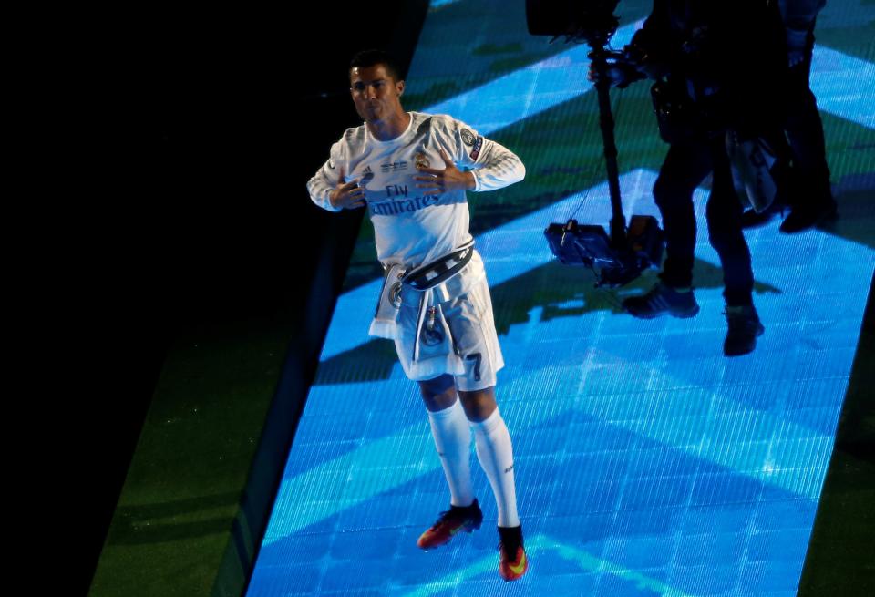 MADRID, SPAIN - MAY 29: Cristiano Ronaldo of Real Madrid greets fans during the celebration after winning the UEFA Champions League Final match against Club Atletico de Madrid, at Santiago Bernabeu Stadium in Madrid, Spain on May 29, 2016.  (Photo by Burak Akbulut/Anadolu Agency/Getty Images)