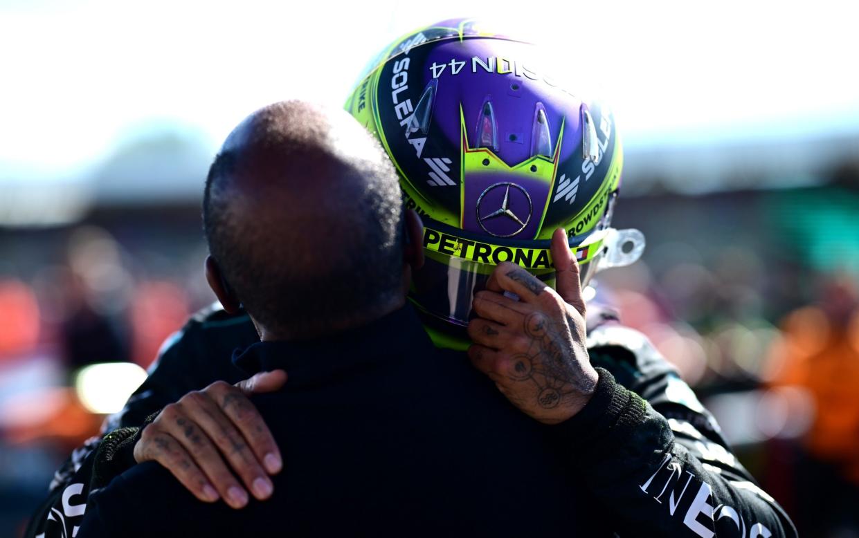 Lewis Hamilton celebrates with father Anthony after winning the F1 Grand Prix of Great Britain at Silverstone July 7