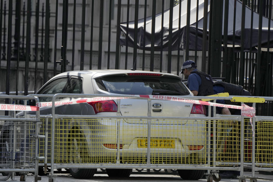 Police at the scene after a car collided with the gates of Downing Street in London in London, Thursday, May 25, 2023. Police say a car has collided with the gates of Downing Street in central London, where the British prime minister's home and offices are located. The Metropolitan Police force says there are no reports of injuries. Police said a man was arrested at the scene on suspicion of criminal damage and dangerous driving. It was not immediately clear whether the crash was deliberate. (AP Photo/Alastair Grant)