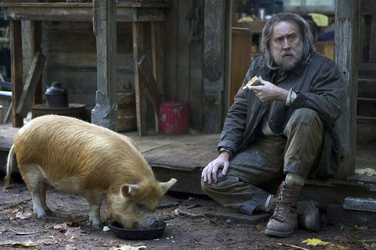 Nicolas Cage and his porcine co-star in the new drama, 'Pig' (Photo: David Reamer/Neon/Courtesy Everett Collection)