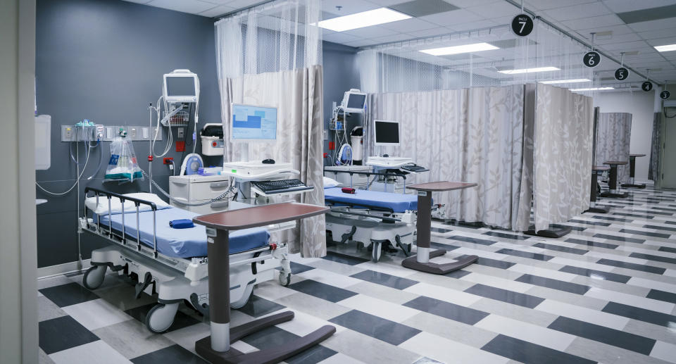 Empty beds on a hospital ward.