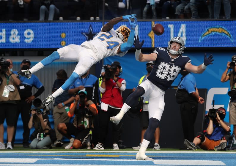 INGLEWOOD, CA - SEPTEMBER 19, 2021: Los Angeles Chargers defensive back Nasir Adderley (24) leaps in the air to break up.