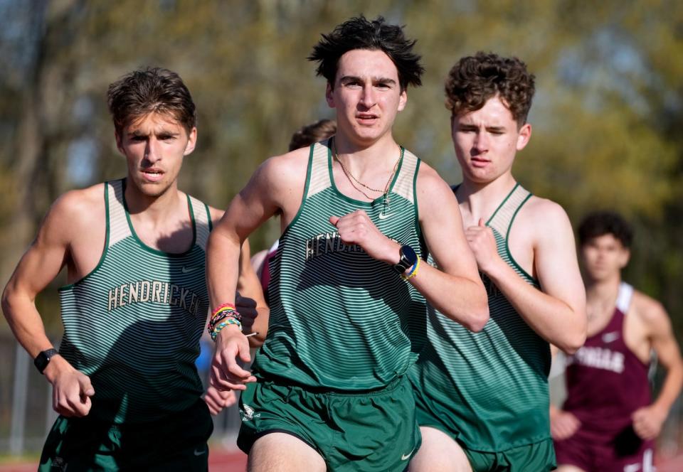 Left to right Troy Silvestri, Brayton Gazerro, and Jack Moretta racing to the finish line in the 1500m. 