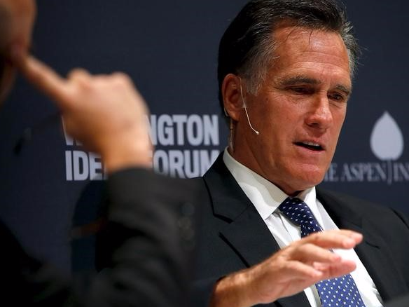 Former Massachusetts Governor Mitt Romney (R) takes part in an onstage interview with The Atlantic Editor-in-chief James Bennet (L) at the Washington Ideas Forum in Washington, September 30, 2015. REUTERS/Jonathan Ernst/Files