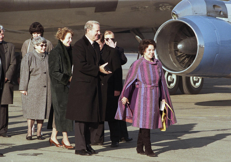 In this Tuesday, Feb. 6, 1990, file photo, U.S. Ambassador to Czechoslovakia Shirley Temple Black, right, leads U.S. Secretary of State James Baker and wife Susan from the plane at Prague Airport, in Prague. Baker arrived for a one-day visit to Prague. Temple, who died at her home near San Francisco, Monday, Feb. 10, 2014, at 85, sang, danced, sobbed and grinned her way into the hearts of Depression-era moviegoers and remains the ultimate child star decades later. (AP Photo/File)