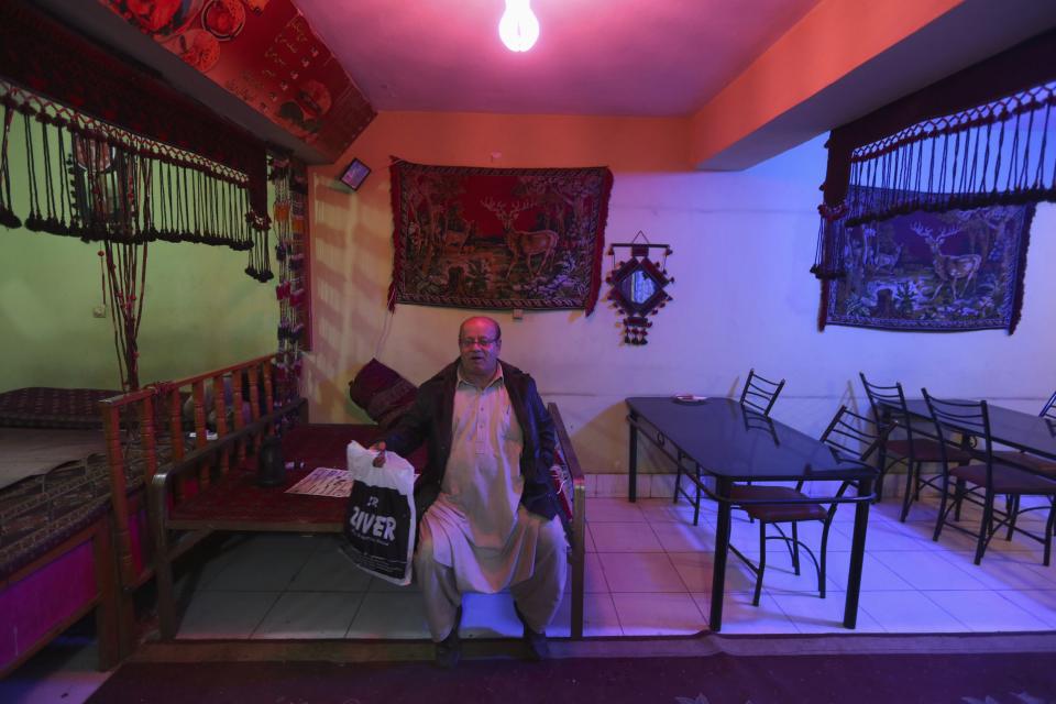 Zabulon Simantov, an Afghan Jew, sits inside his cafe in Kabul