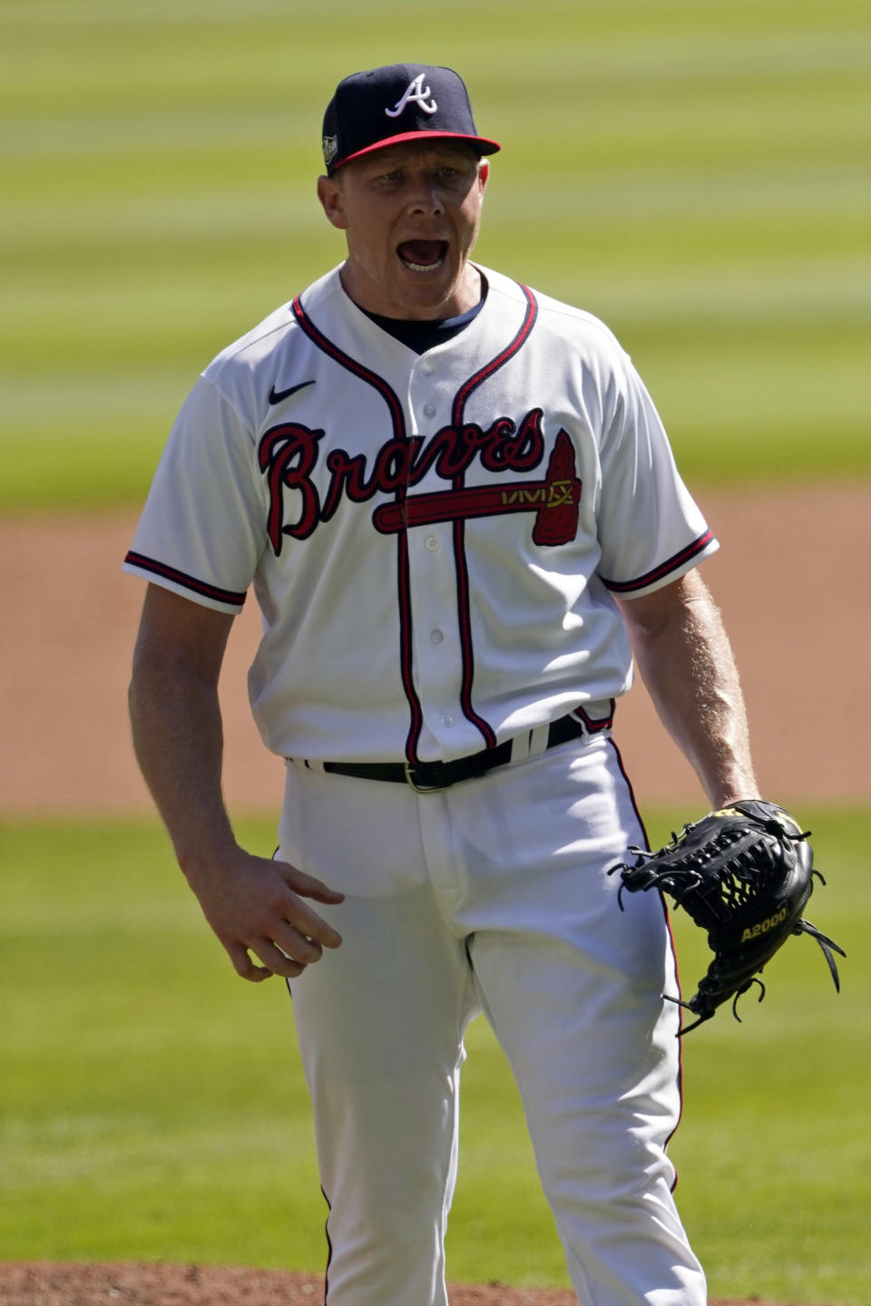 Atlanta Braves relief pitcher Mark Melancon (36) reacts after their final out against the Cincinnati Reds in Game 2 of a National League wild-card baseball series, Thursday, Oct. 1, 2020, in Atlanta. (AP Photo/John Bazemore)