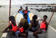 Wider Image: Meet Senegal's first female pro surfer inspiring girls to take to the waves