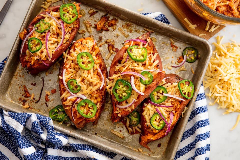<p>Missing summertime <a href="https://www.delish.com/cooking/recipe-ideas/g3458/bbq-chicken-recipes/" rel="nofollow noopener" target="_blank" data-ylk="slk:BBQ chicken" class="link ">BBQ chicken</a>? Stuff sweet potatoes with <a href="https://www.delish.com/cooking/g577/recipes-with-rotisserie-chicken/" rel="nofollow noopener" target="_blank" data-ylk="slk:rotisserie chicken" class="link ">rotisserie chicken</a> and your favorite <a href="https://www.delish.com/cooking/g257/barbecue-sauce-recipes/" rel="nofollow noopener" target="_blank" data-ylk="slk:BBQ sauce" class="link ">BBQ sauce</a>, then top them with Gouda for a <a href="https://www.delish.com/cooking/g3456/healthy-chicken-recipes/" rel="nofollow noopener" target="_blank" data-ylk="slk:healthy chicken" class="link ">healthy chicken</a> dinner you can enjoy long into fall and beyond.</p><p>Get the <strong><a href="https://www.delish.com/cooking/recipe-ideas/recipes/a49187/barbecue-chicken-sweet-potatoes-recipe/" rel="nofollow noopener" target="_blank" data-ylk="slk:BBQ Chicken Twice-Baked Potatoes recipe" class="link ">BBQ Chicken Twice-Baked Potatoes recipe</a></strong>.</p>