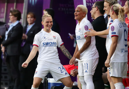 Soccer Football - Women's Champions League Final - Ferencvaros Stadium, Budapest, Hungary - May 18, 2019 Olympique Lyonnais' Jess Fishlock celebrates winning the Women's Champions League with team mates REUTERS/Lisi Niesner