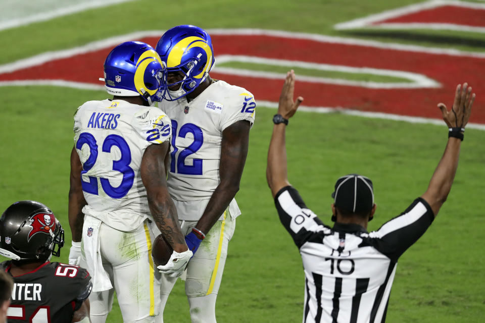 Los Angeles Rams running back Cam Akers (23) celebrates his touchdown against the Tampa Bay Buccaneers with wide receiver Van Jefferson (12) during the second half of an NFL football game Monday, Nov. 23, 2020, in Tampa, Fla. (AP Photo/Mark LoMoglio)