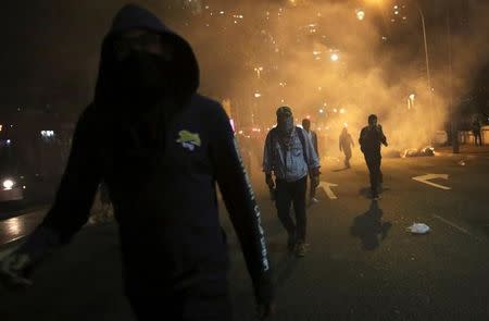 Riot police (not pictured) clash with demonstrators during a protest against Brazil's new President Michel Temer after Brazil's Senate removed former Dilma Rousseff in Sao Paulo, Brazil, August 31, 2016. REUTERS/Nacho Doce