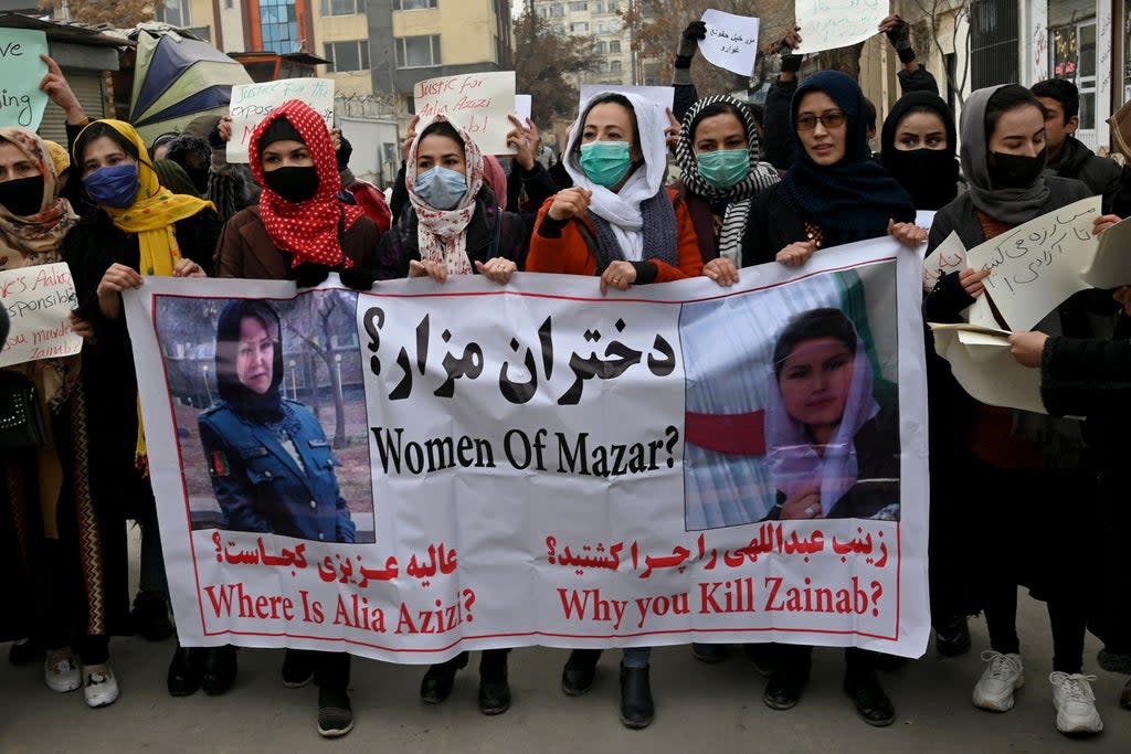 File photo: Afghan women march as they chant slogans and hold banners during a women’s rights protest in Kabul on 16 January 2022 (AFP via Getty Images)