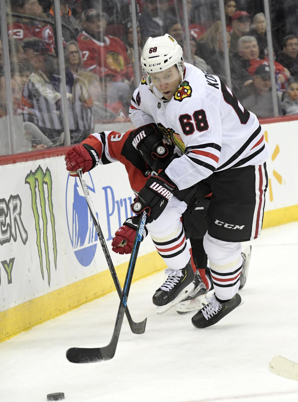 Chicago Blackhawks defenseman Slater Koekkoek (68) chases after the puck during the second period of an NHL hockey game against the New Jersey Devils,Friday, Dec. 6, 2019, in Newark, N.J. (AP Photo/Bill Kostroun)