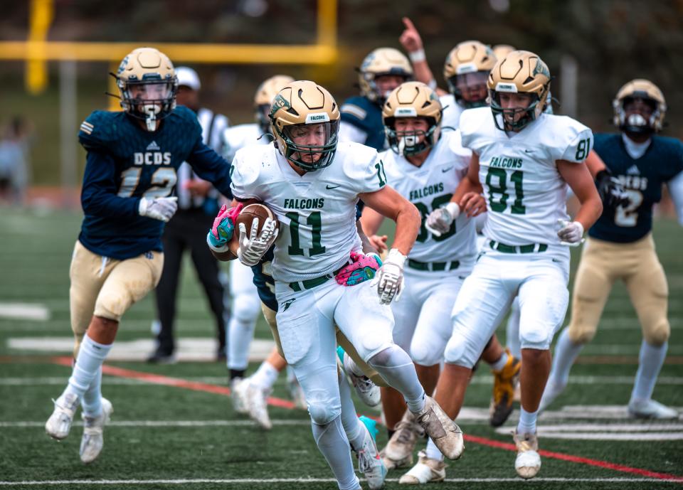 Monroe St. Mary Catholic Central's Brady Hines runs for a first down during a football game on Saturday, Oct. 21, 2023, at Detroit Country Day.