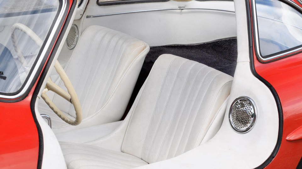 Mercedes-Benz originally offered a pair of fitted leather suitcases for the luggage shelf behind the seats. - Credit: Hilton and Moss