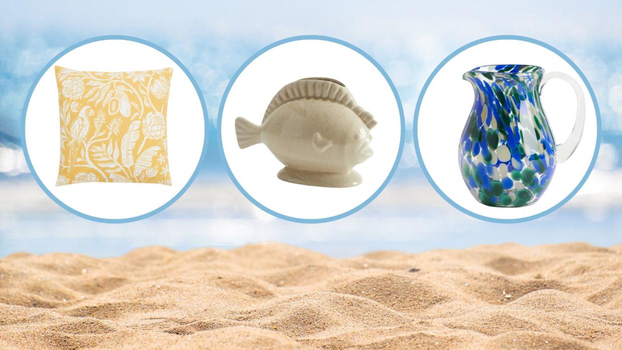  H&M summer home decor items including a yellow throw pillow, a fish vase, and a blue pitcher on a beachy background. 
