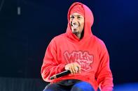 <p>Nick Cannon wears his trademark red hoodie during opening night of Nick Cannon Presents: MTV Wild 'N Out Live at Atlanta's Cellairis Amphitheatre at Lakewood on May 20.</p>