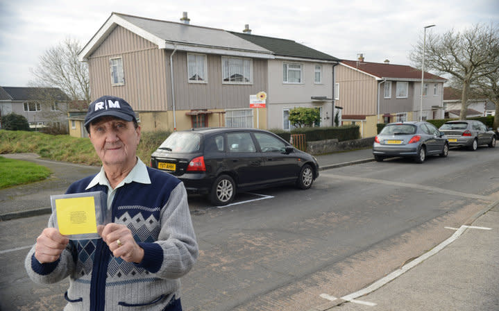 Not happy: Donald Ligertwood with his home made parking ticket (SWNS)