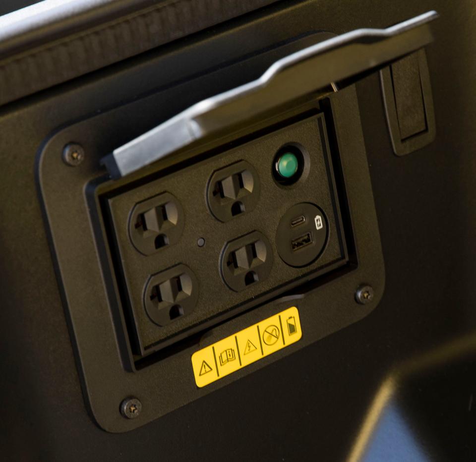 A charging port is featured in the front of the new Ford F-150 Lightning, an all-electric truck, outside the Edge Motor Museum on Wednesday, June 29, 2022, in Memphis.