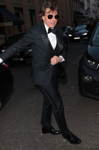 <p>SplashNews</p> Tom Cruise arrives at Victoria Beckham's 50th birthday party in London