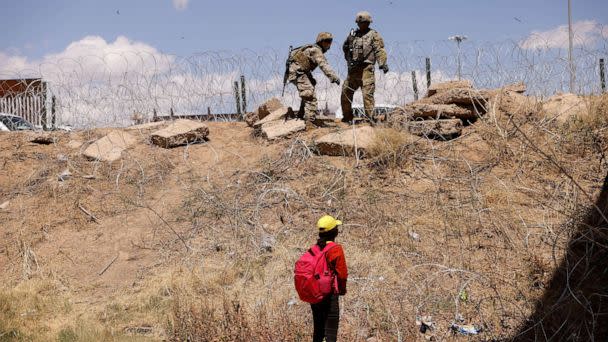 PHOTO: FILE - A young migrant, traveling alone from Guatemala, stands near the Rio Bravo river after crossing the border, to request asylum in the United States, as members of the Texas Army National Guard extend razor wire to inhibit migrants crossing (Jose Luis Gonzalez/Reuters, FILE)