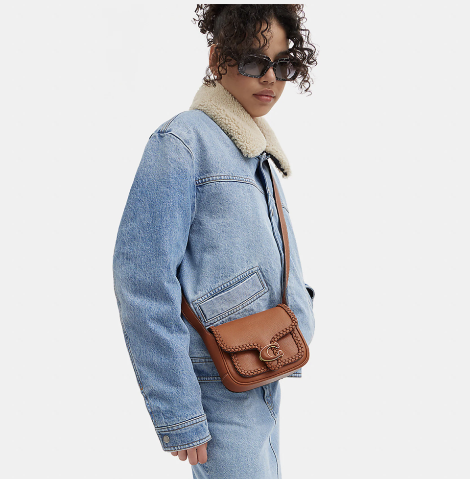 someone wearing the coach Tabby Messenger 19 With Braid