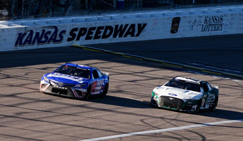 Bubba Wallace (45) of 23XI Racing leads driver Brad Keselowski (6) during the Hollywood Casino 400 at Kansas Speedway on Sept. 11, 2022.