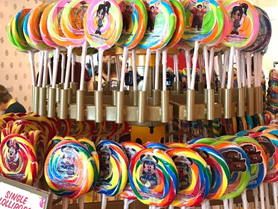 display of disney themed lollipops at disney world shop