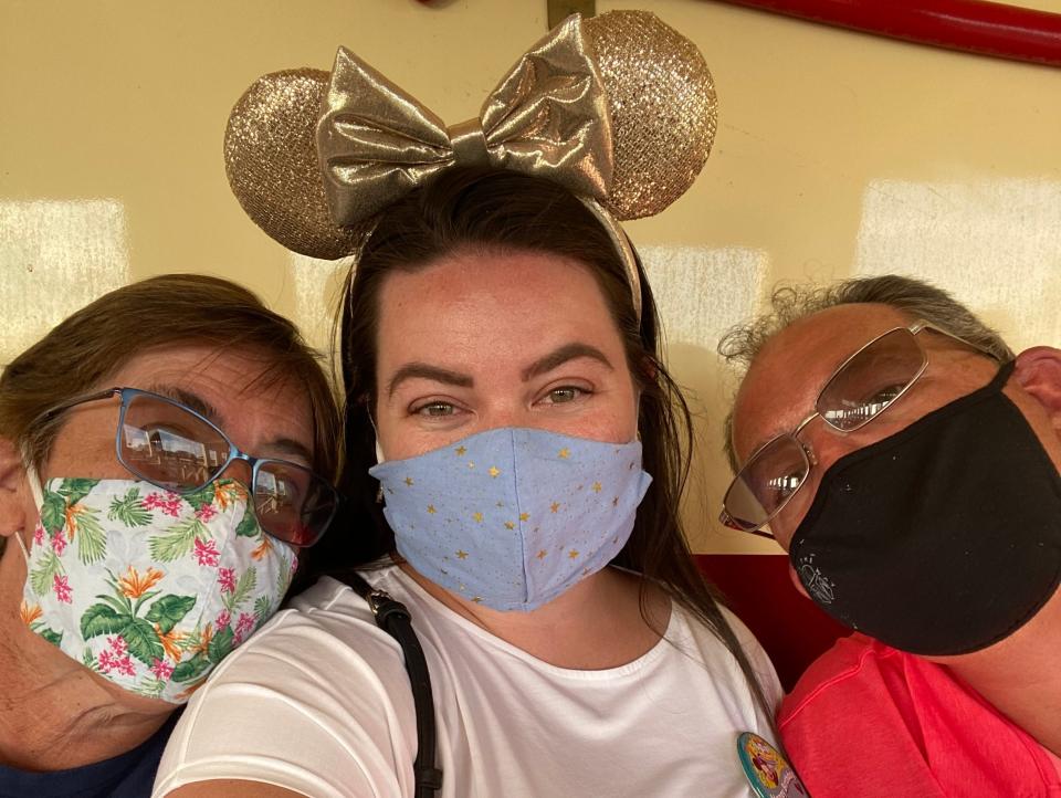 megan dubois taking a selfie with her family at disney world